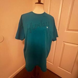 XL Hurley Men’s Tee Shirt Blue Hurley wrote onchest pit-pit=23” length=28” C3011